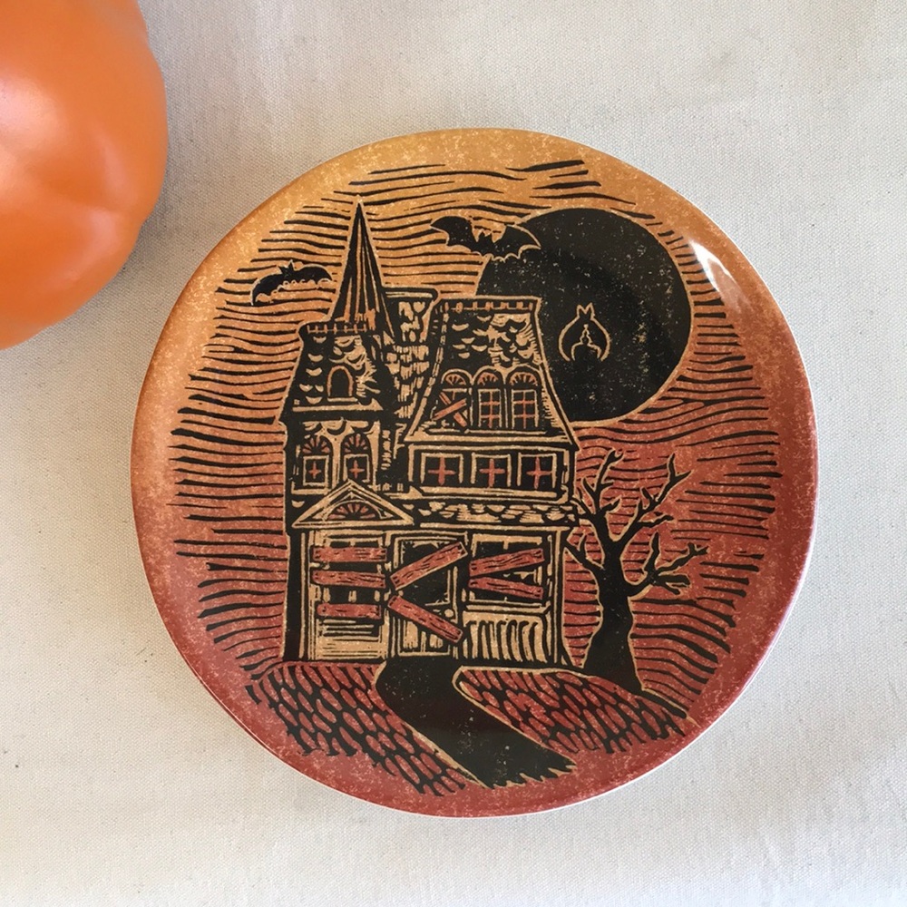 Pottery Barn Halloween plate haunted house woodcut burnt orange and black